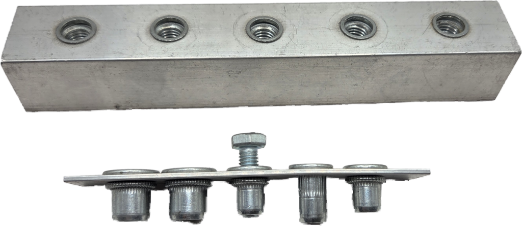 Rivnut threaded inserts installed in a metal plate